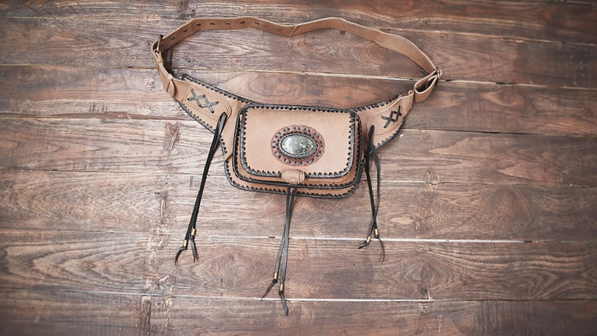 Genuine leather waist belt with front flap pocket and stitching detail