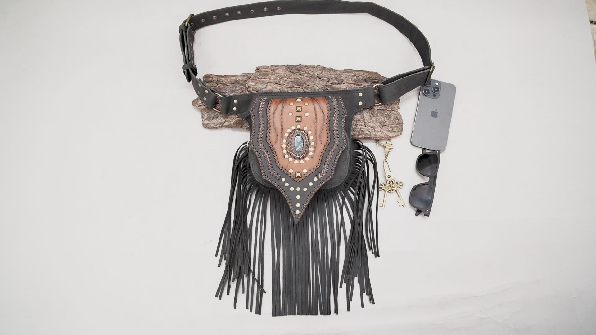 Boho leather hip bag with labradorite stone, studs and fringe detailing.