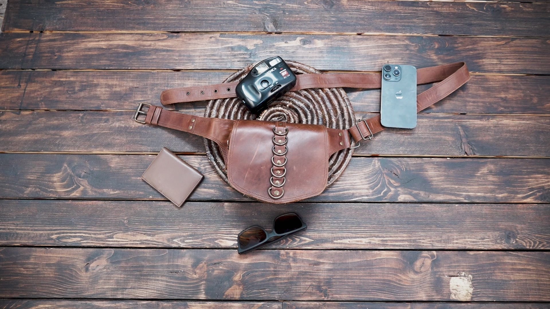 Artisan leather waist belt bag with decorative ring accents