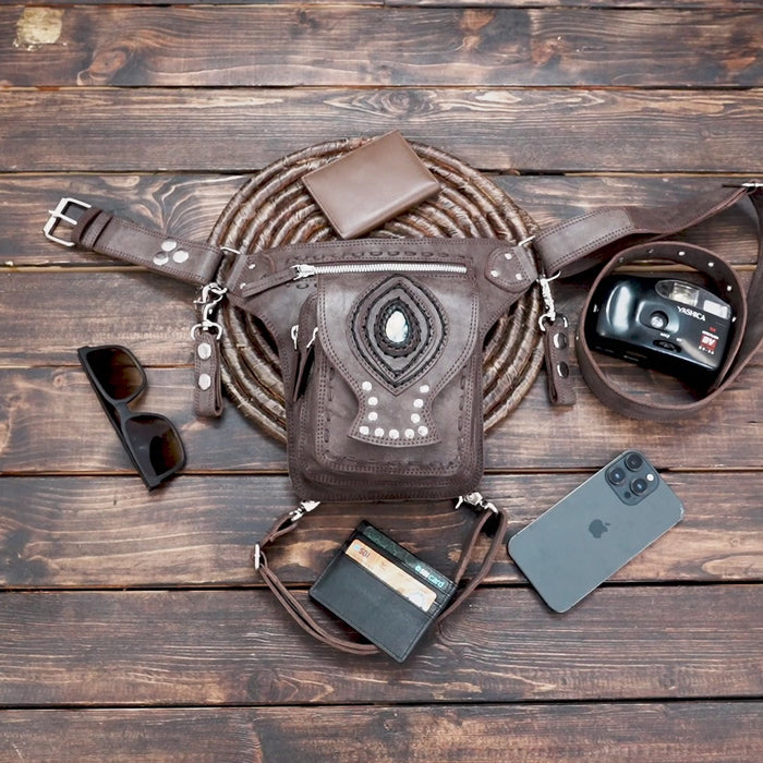 Brown leather hip bag with tribal design and rivet details