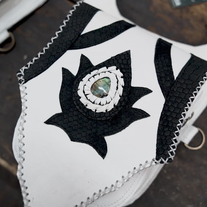 “Handcrafted white and black leather shoulder holster with dual pouches”