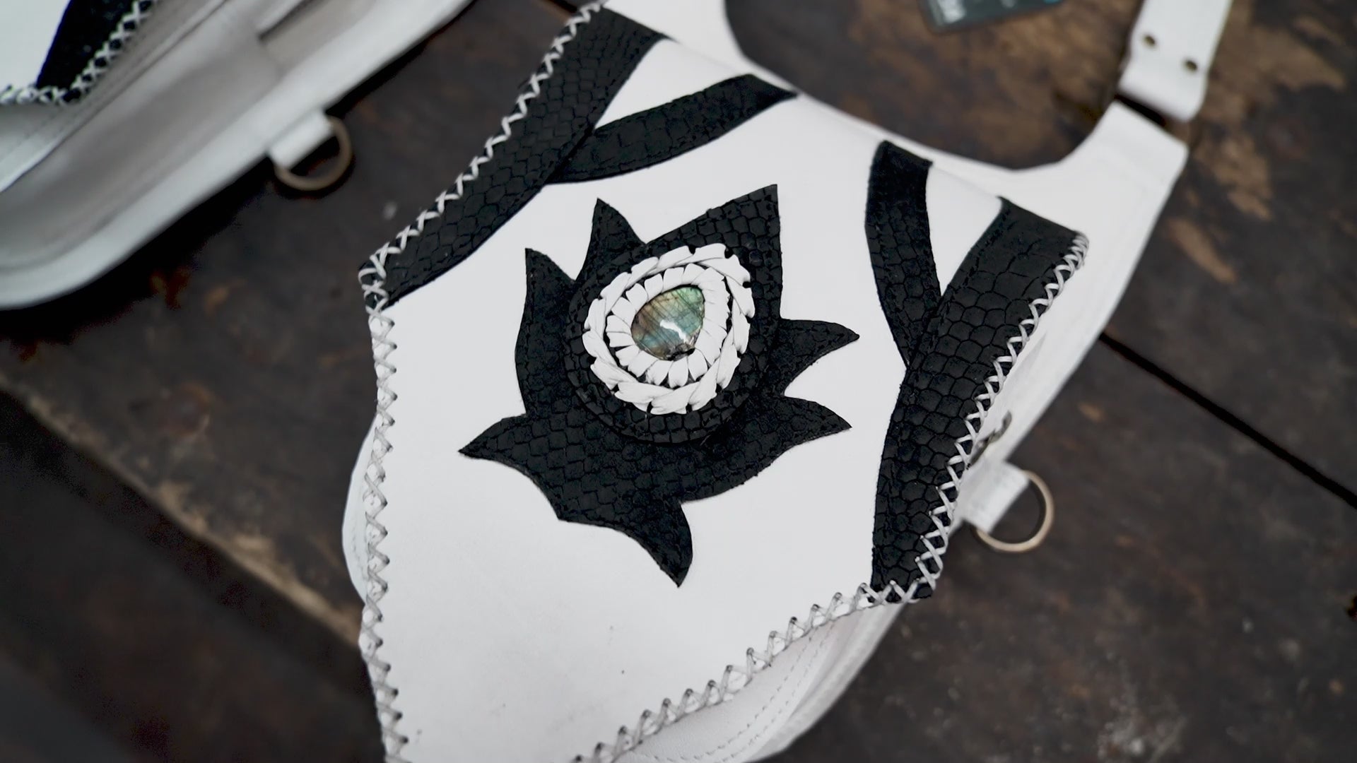 “Handcrafted white and black leather shoulder holster with dual pouches”