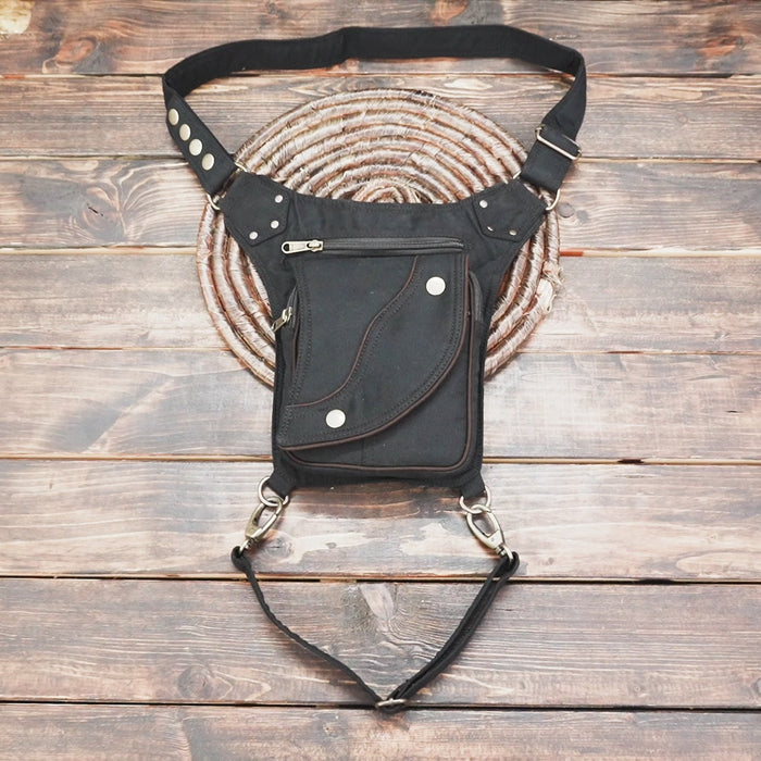 Multi-pocket black cotton waist pack festival bag with leg loop.