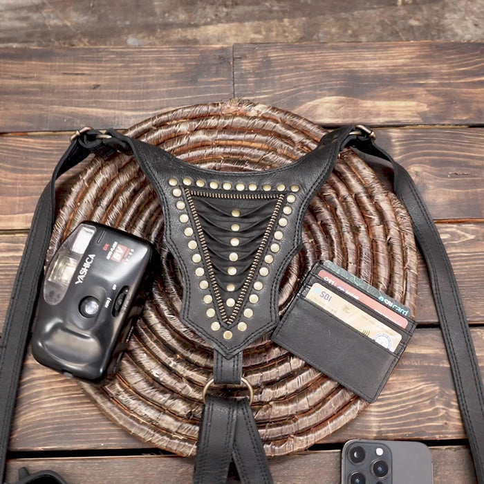 “Handmade dual pouch leather holster with zipper closures and metal studs”