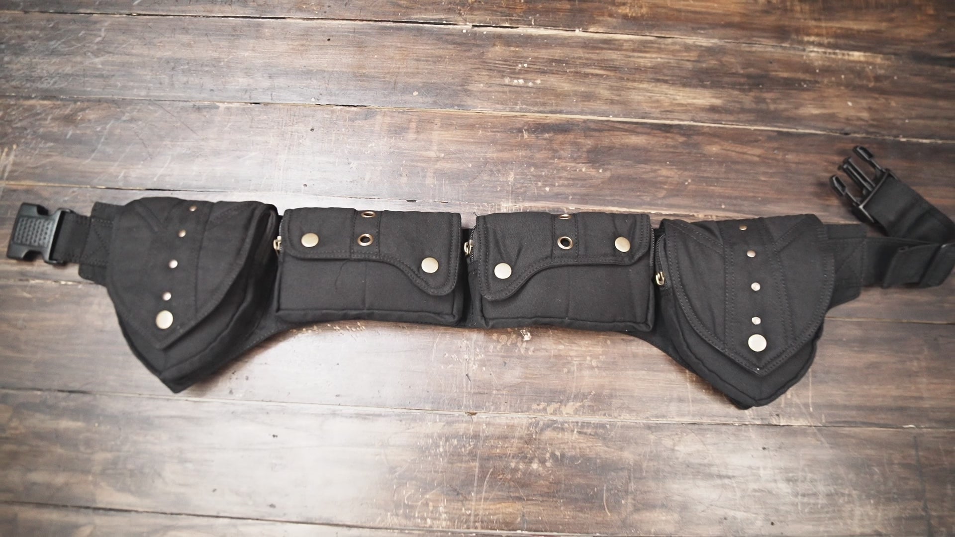 Close-up of black utility belt pocket with snaps