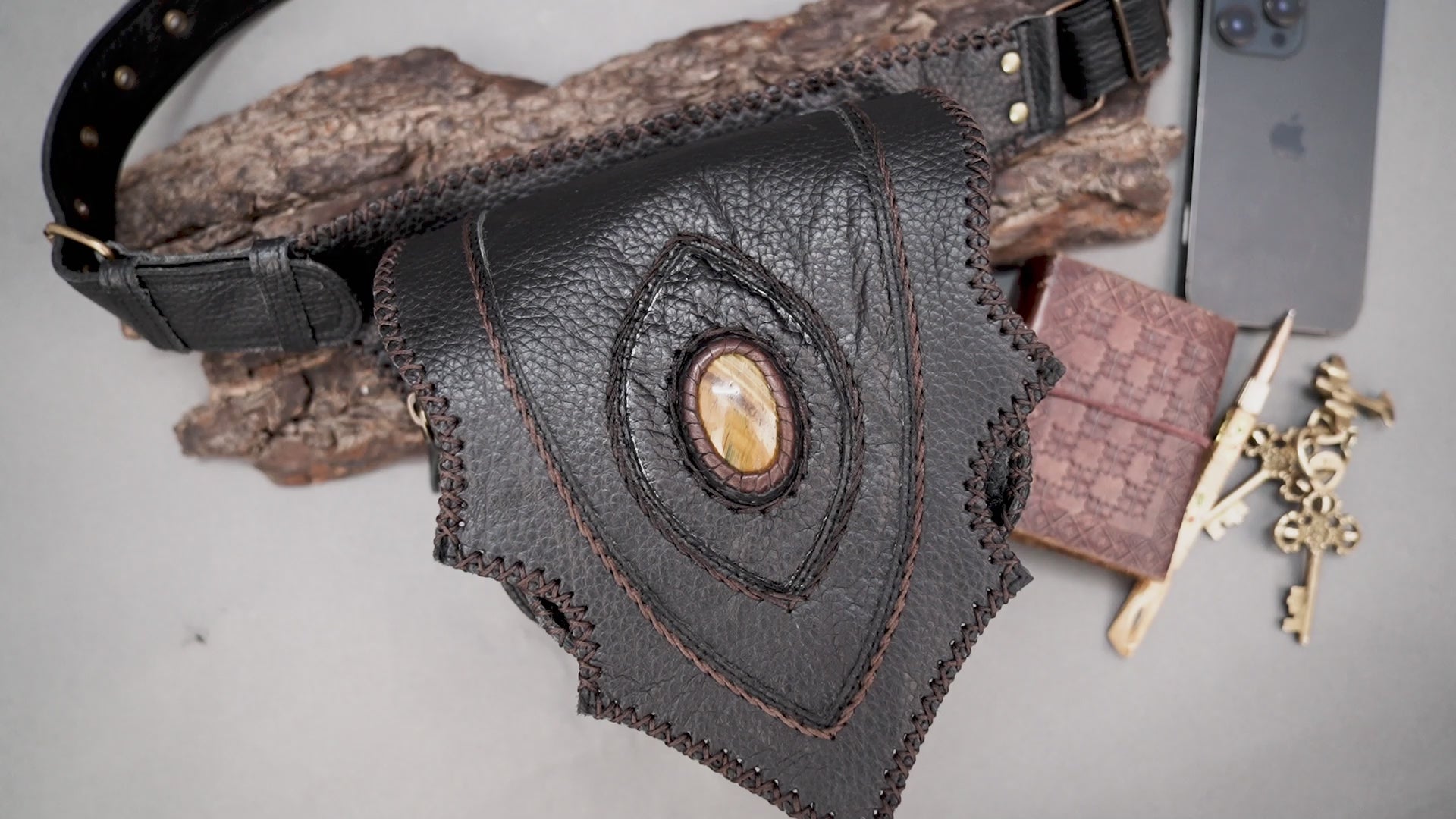 Tribal style leather hip pouch with oval stone inlay