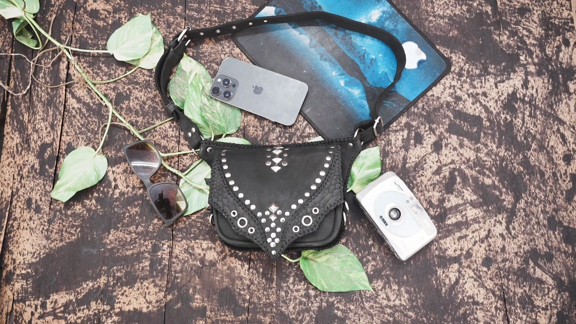 Handmade leather hip pouch with metal accents