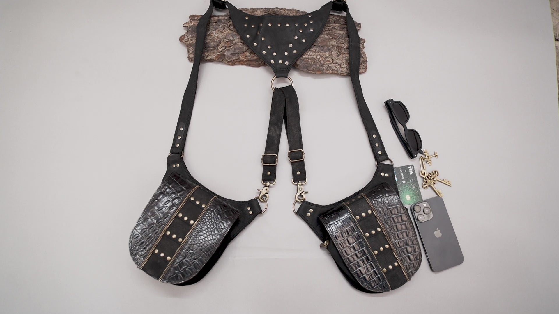 Studded leather shoulder rig with embossed holster pockets