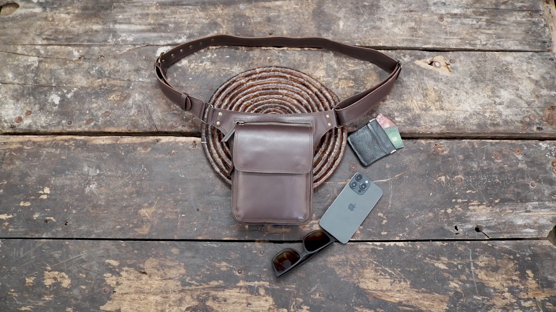 Handmade brown leather hip bag with secure flap pocket