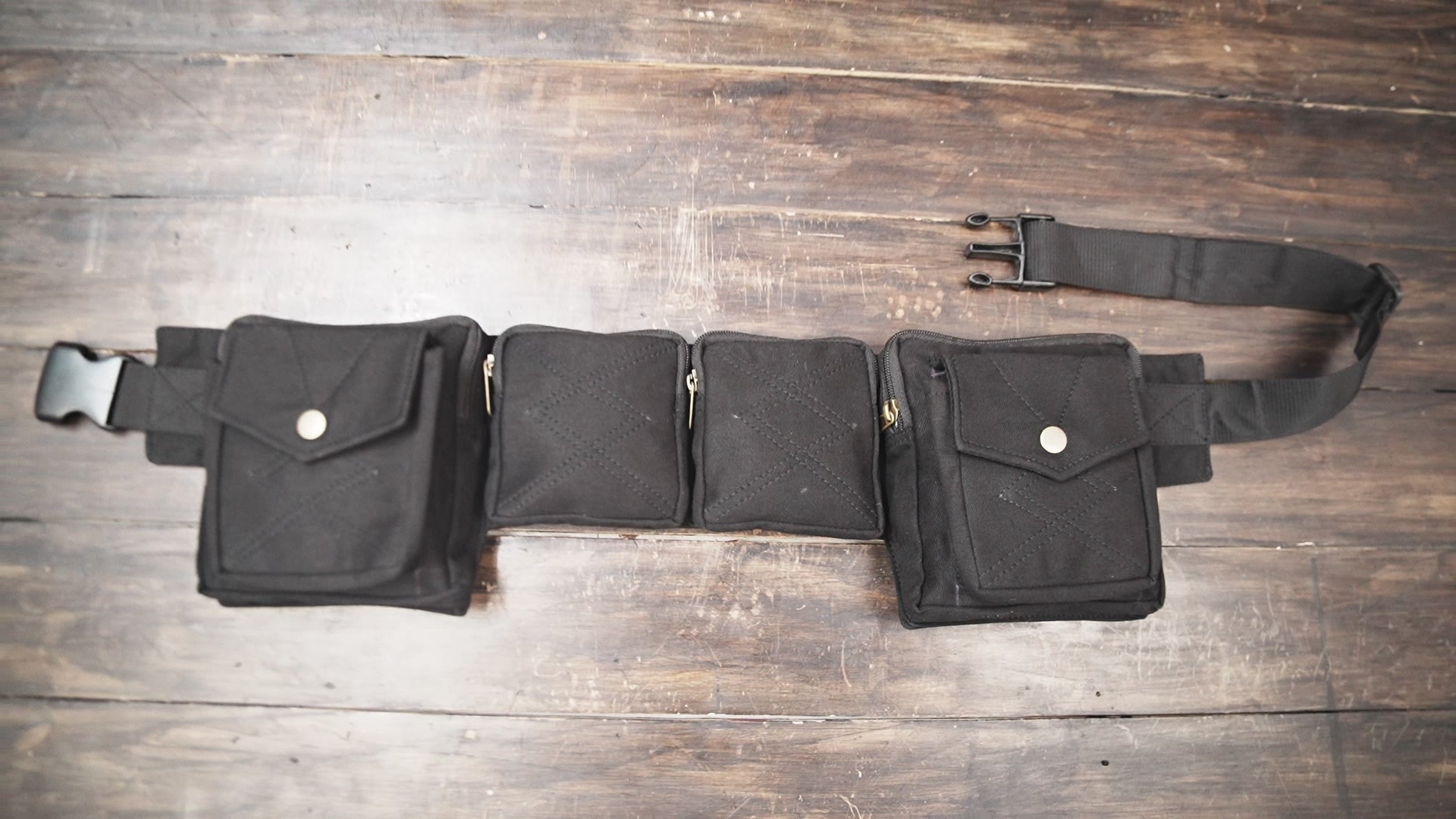 Handmade black cotton waist pack with secure utility pouches and adjustable belt