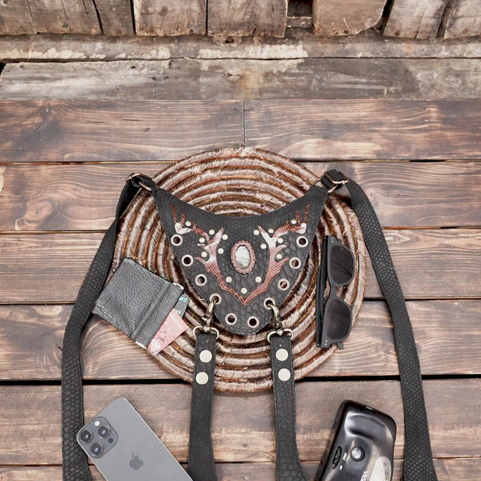 Handmade leather shoulder holster with reptile pattern and antique hardware