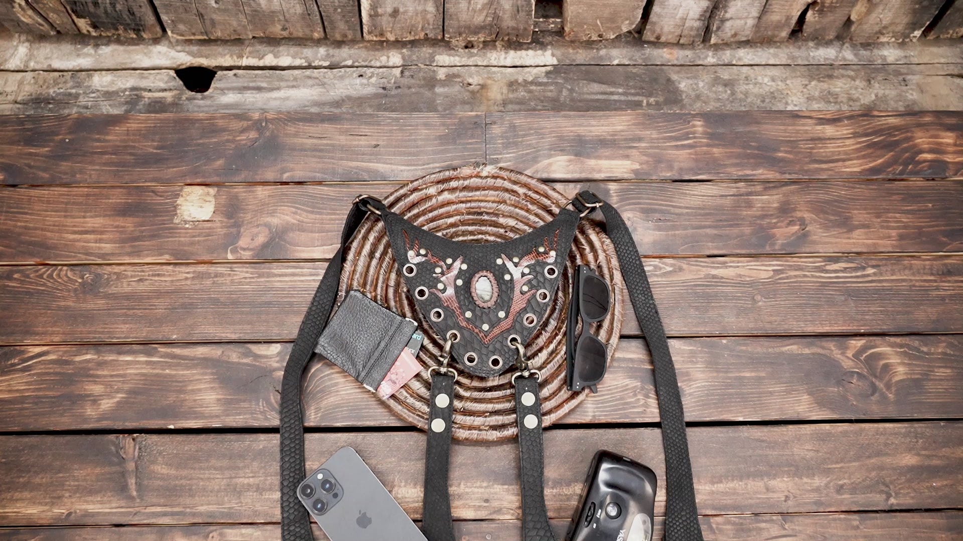 Handmade leather shoulder holster with reptile pattern and antique hardware