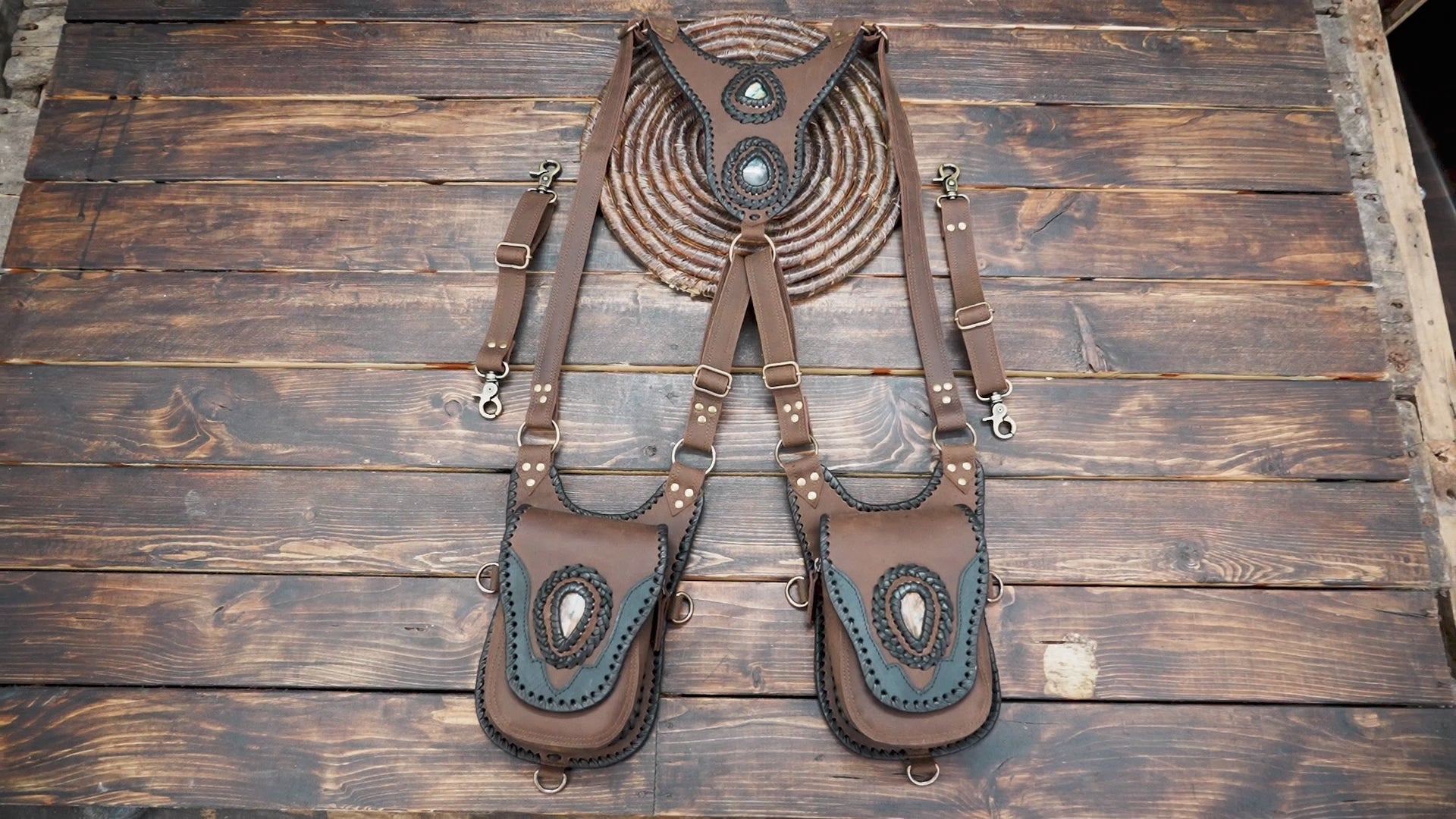 Adjustable brown leather shoulder holster with artisan stitching