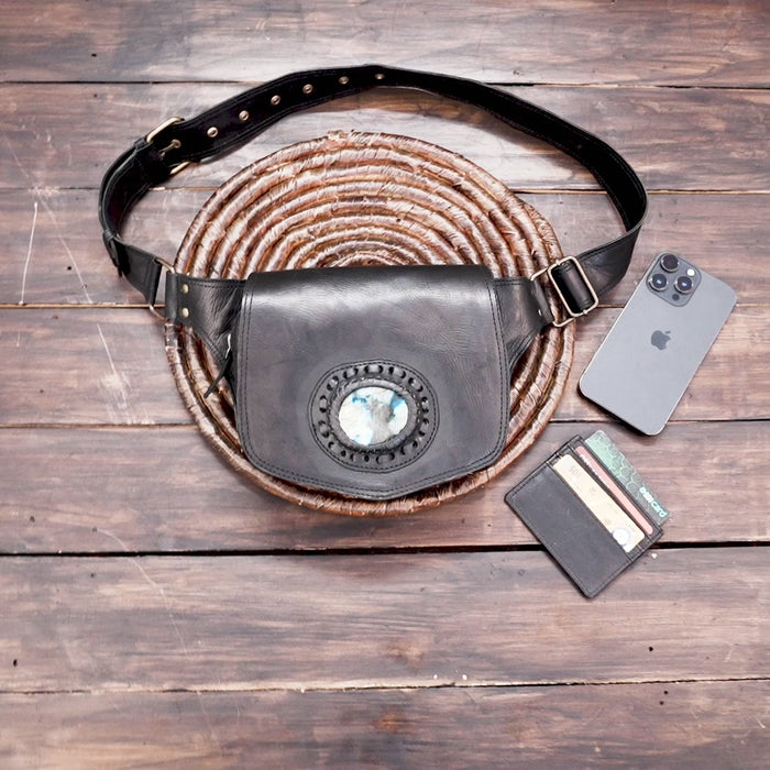 Black leather belt bag with decorative stone centerpiece