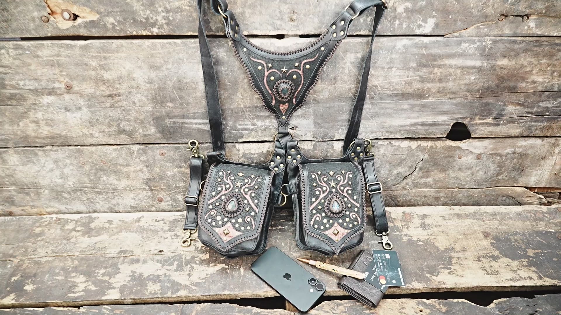 “Handcrafted black leather festival holster featuring ornate copper detailing”