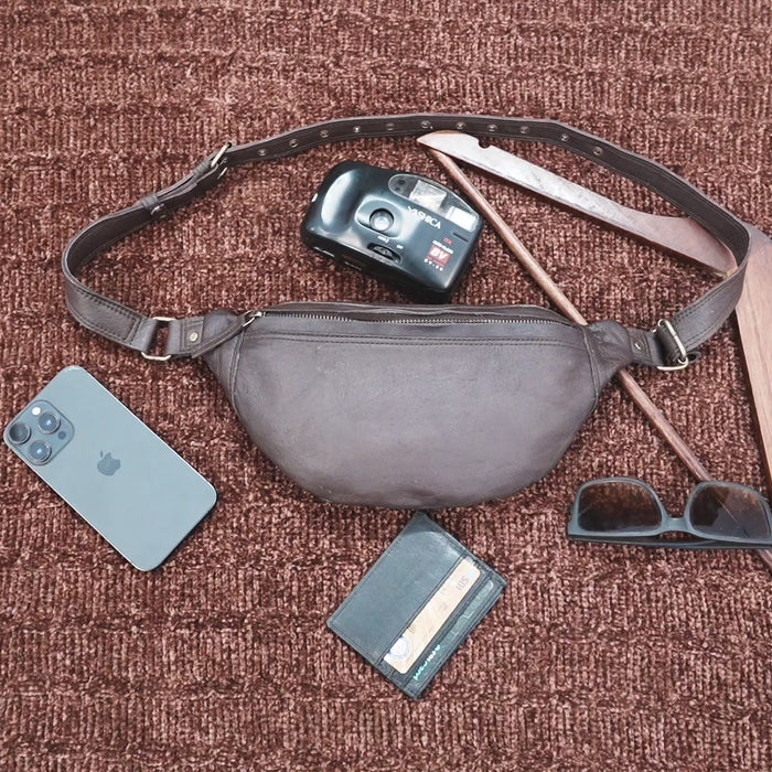 Handmade leather waist pouch with smooth finish and secure buckle
