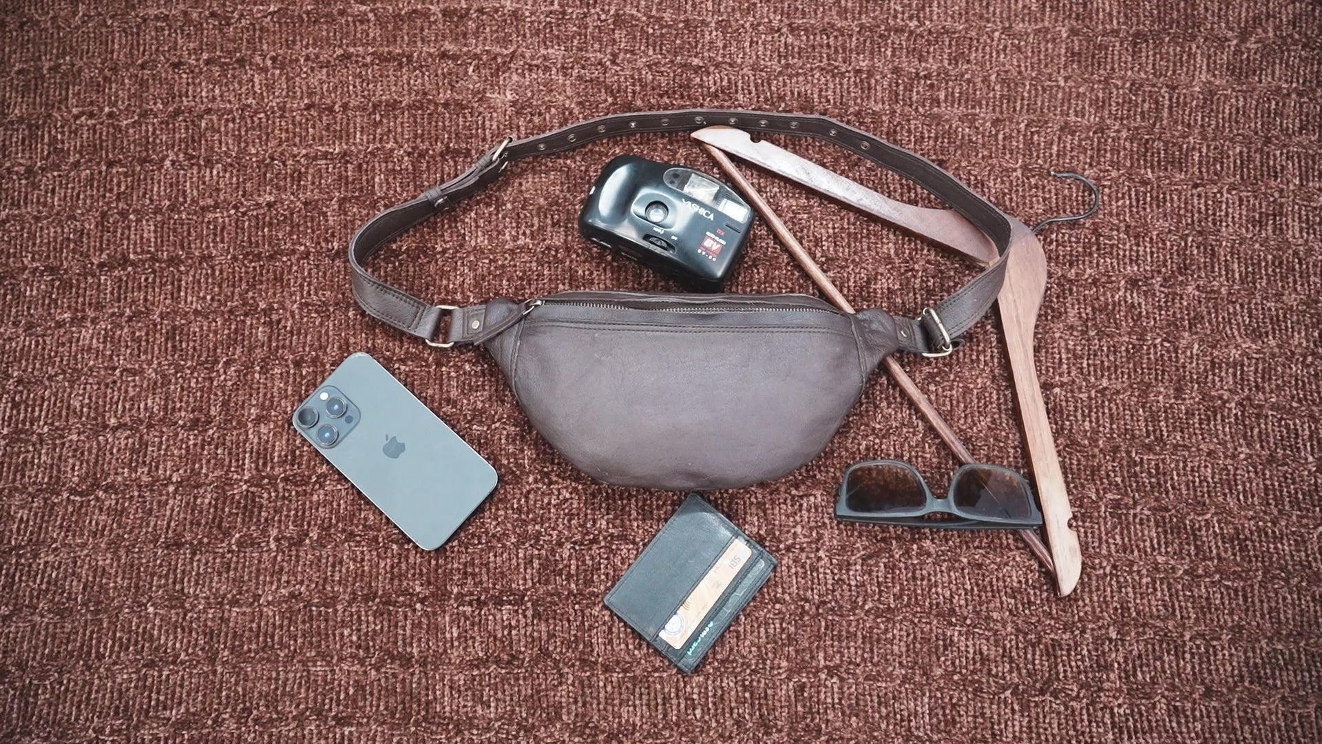 Handmade leather waist pouch with smooth finish and secure buckle