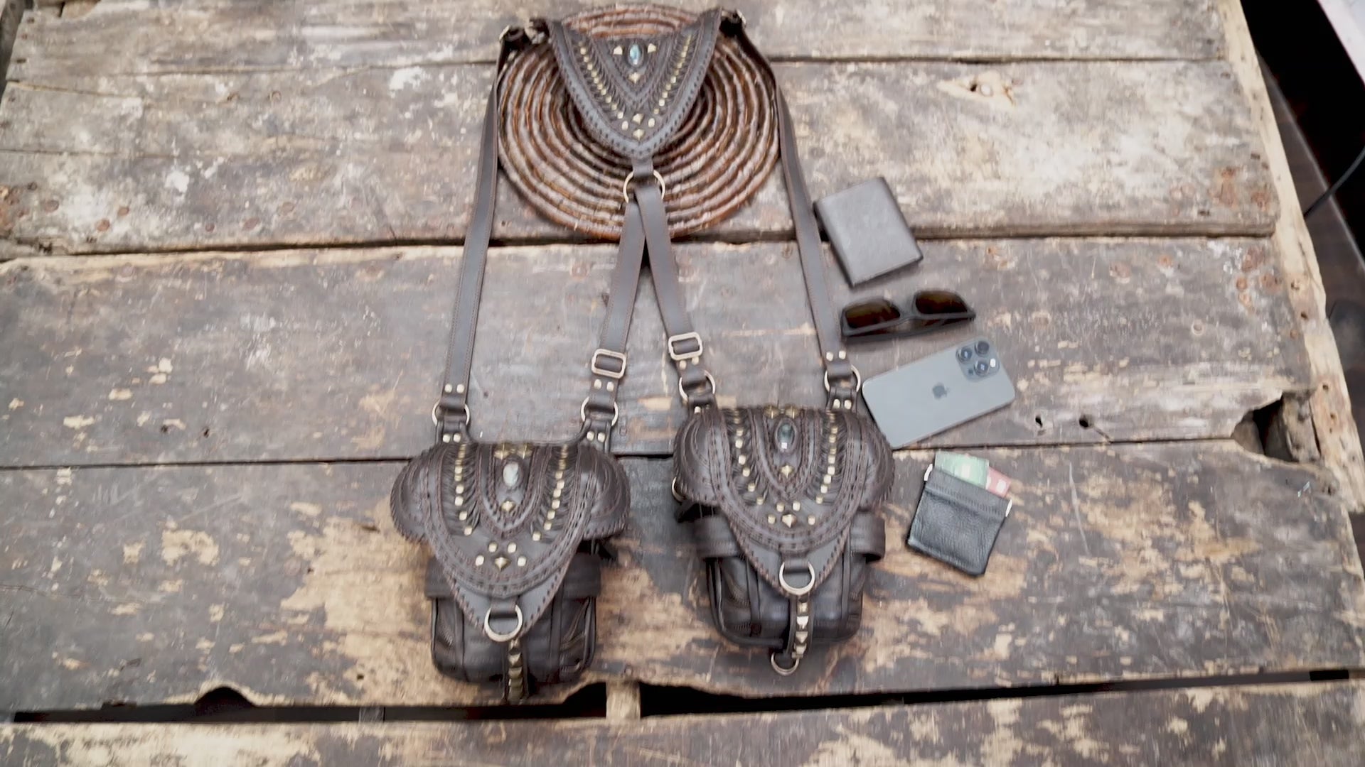 “Handcrafted brown leather festival holster with layered flap and brass studs”