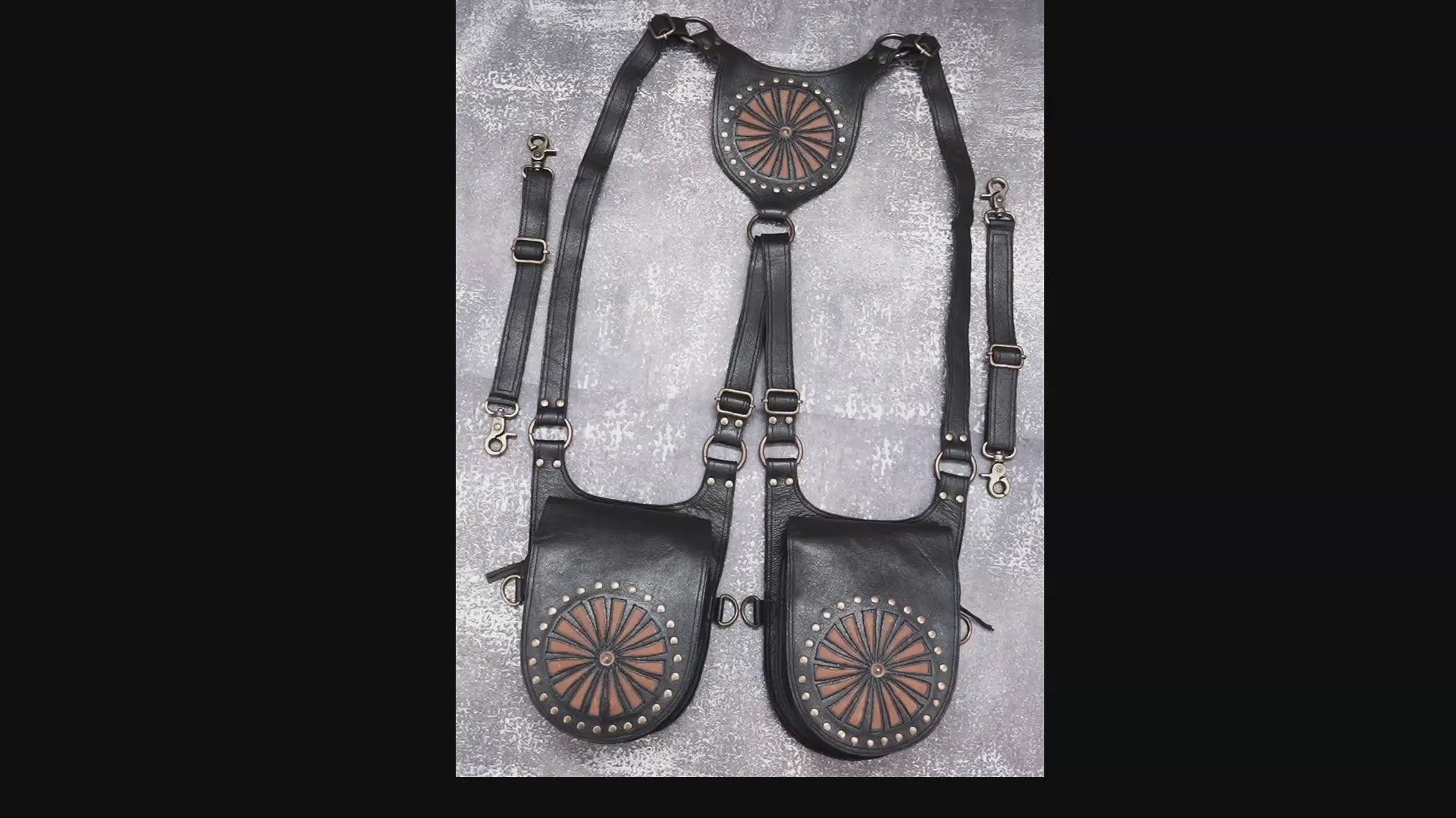 Handmade leather shoulder holster with decorative circular pattern
