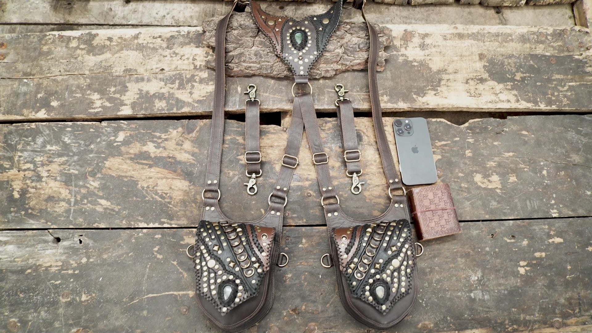 style leather shoulder holster with adjustable straps and brass hardware