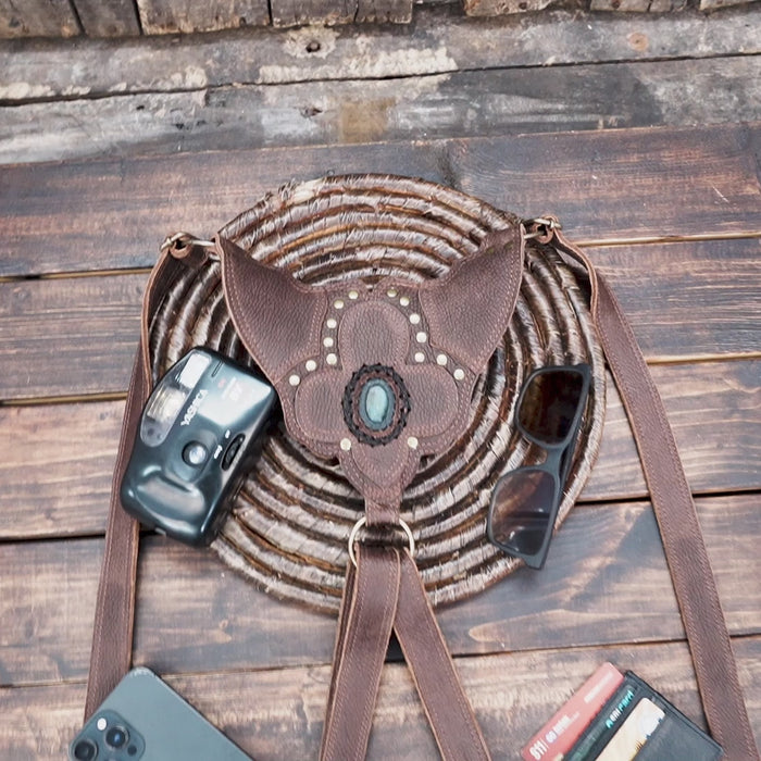 Artisan leather festival bag with dual pockets and brass rivets