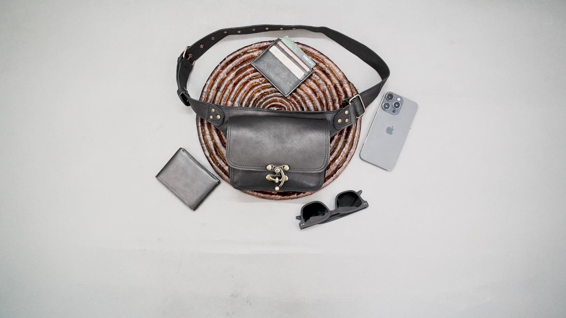 Handmade black leather hip pouch with secure metal clasp