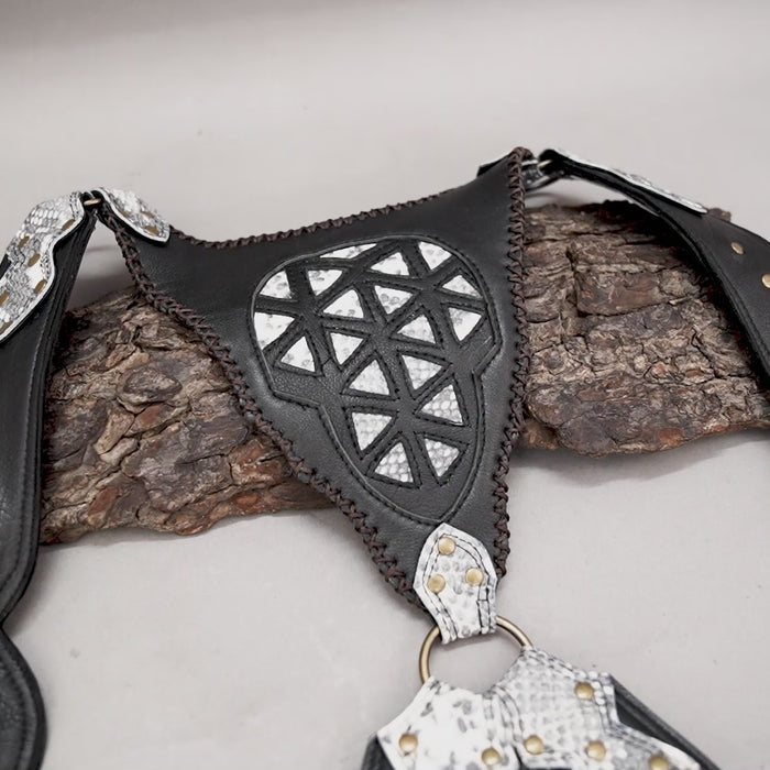 Dual-pouch leather holster with silver geometric pattern and stone detail