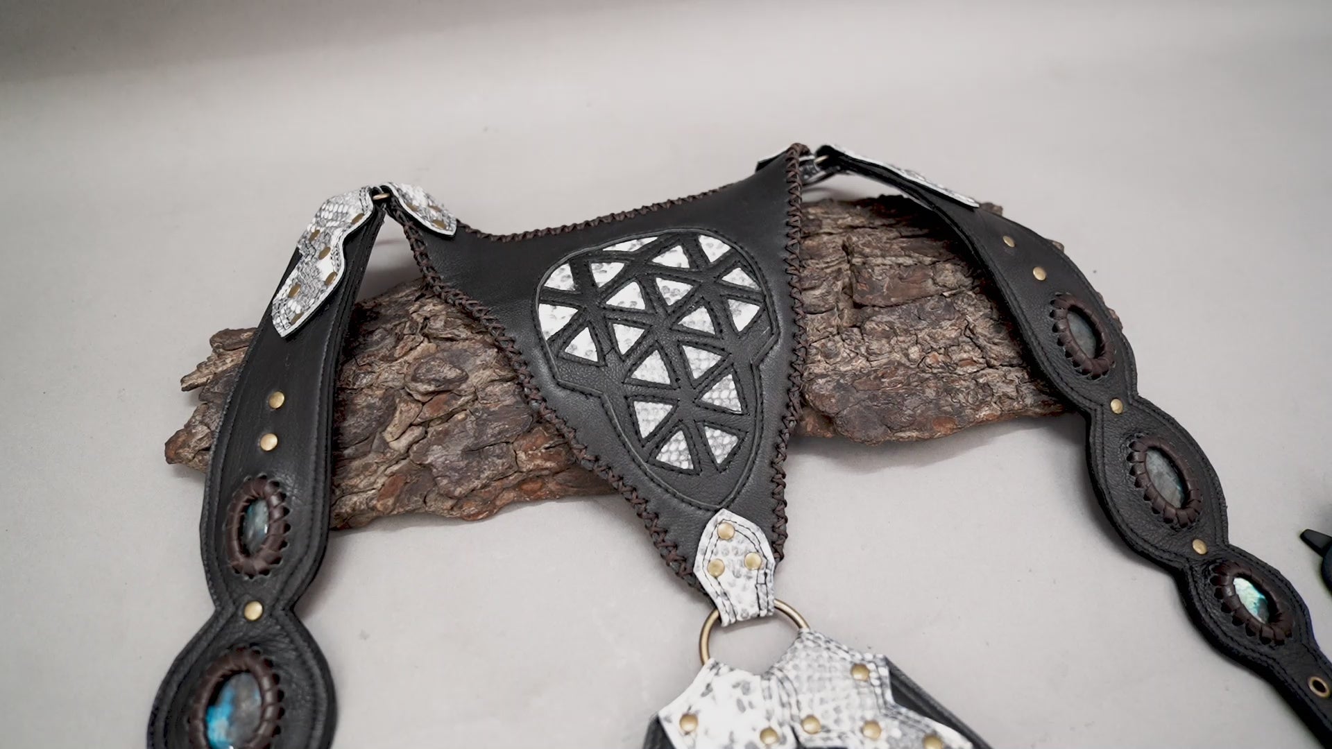 Dual-pouch leather holster with silver geometric pattern and stone detail