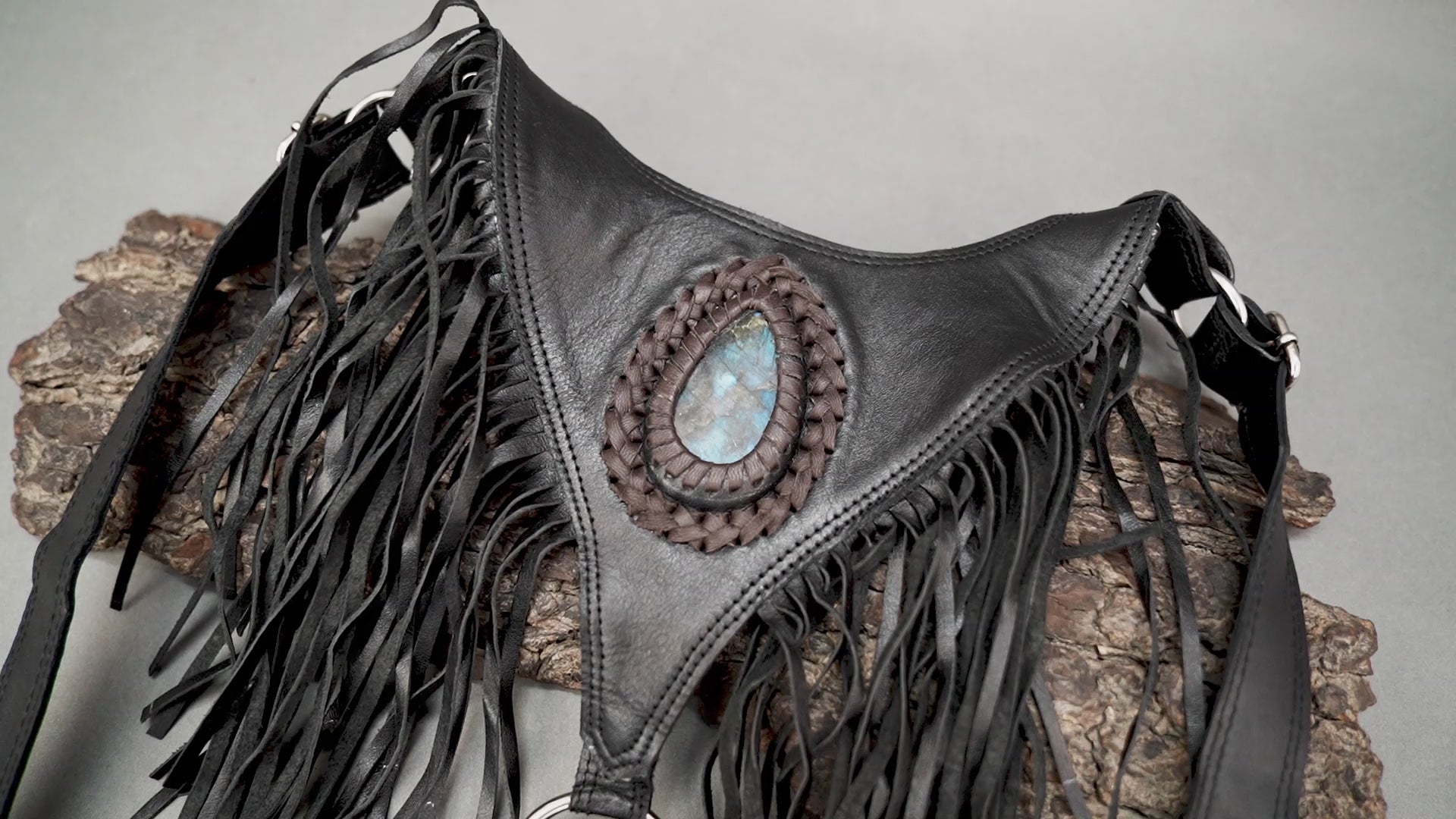 Steampunk-inspired fringe leather holster with natural stones