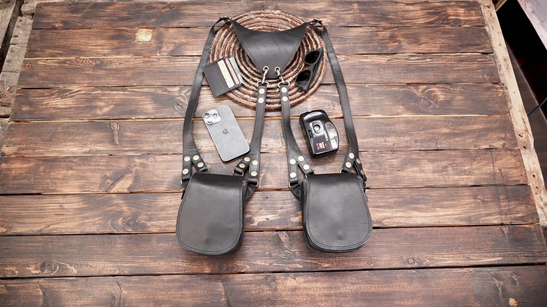 Minimalist black leather holster bag with two storage pockets