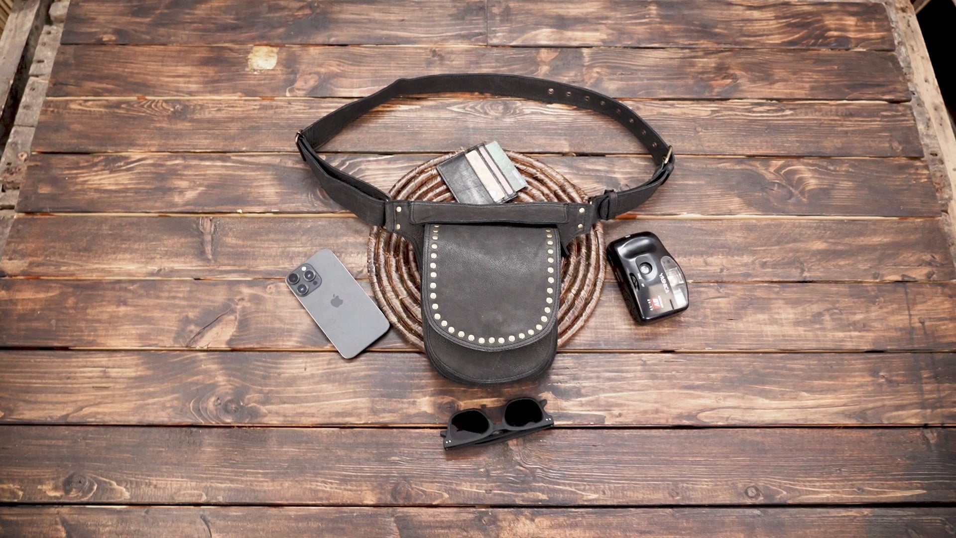 Leather waist belt featuring a single pouch with flap closure
