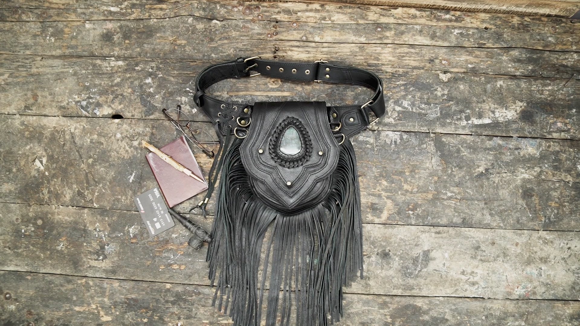 Black leather fringe waist belt with gemstone centerpiece