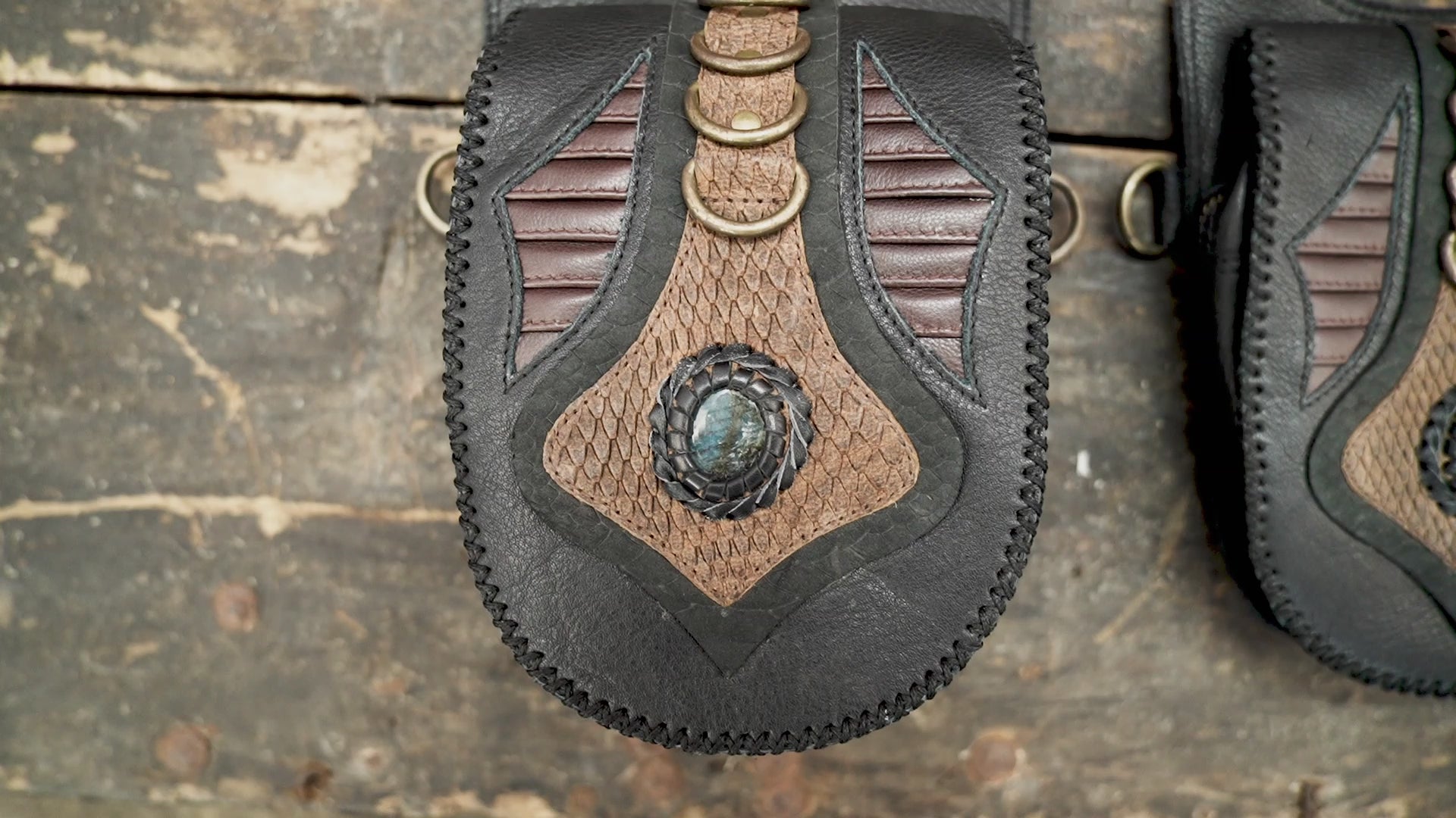 Black leather harness holster with dual utility bags and adjustable straps