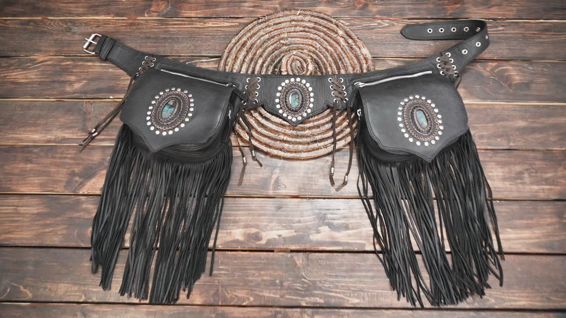 Handmade leather waist belt with fringe pockets and lace-up design