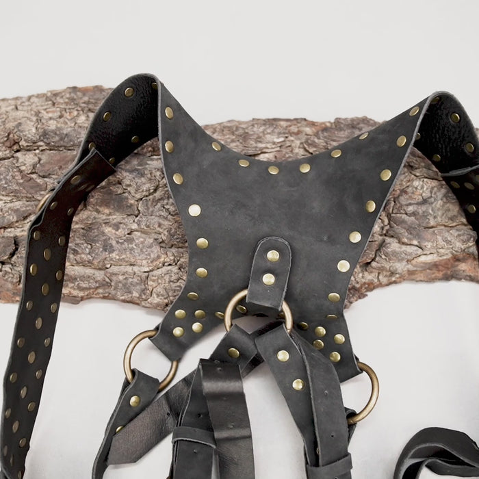 Black leather harness holster with tassel fringe detailing