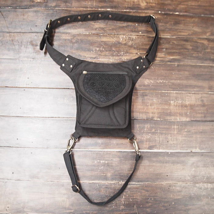 Cotton waist bag with thigh strap and boho embroidered front design.
