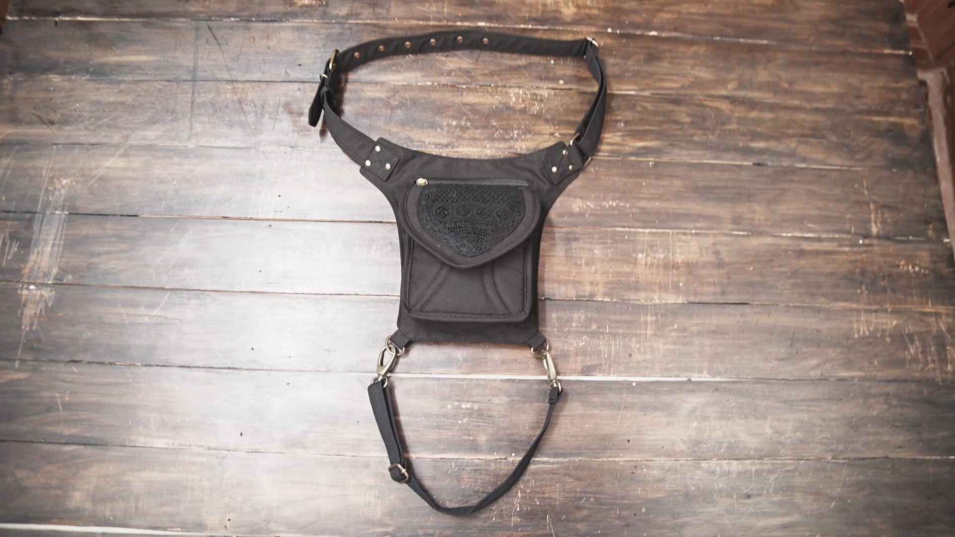 Cotton waist bag with thigh strap and boho embroidered front design.