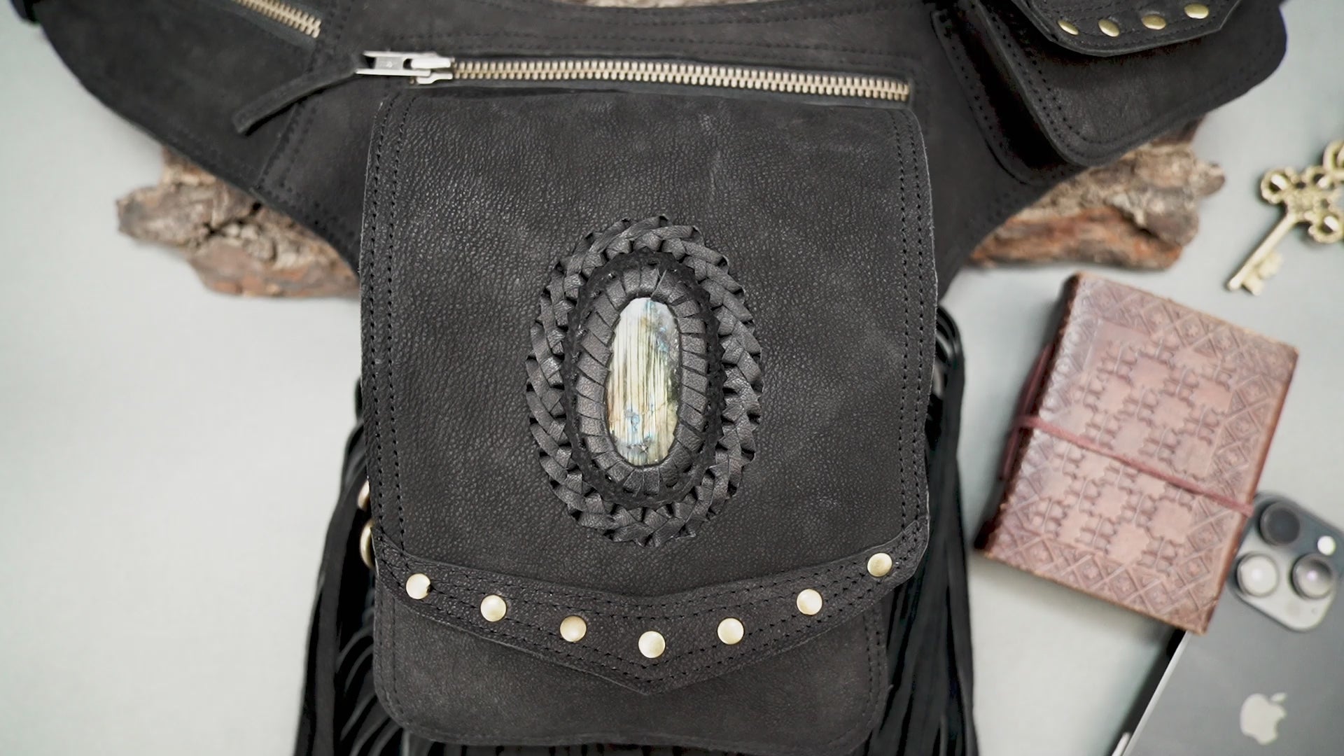 Boho leather waist belt bag with fringe detailing and zip pockets