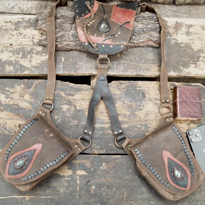 “Handcrafted brown leather holster with tribal patchwork design and stone inlay”