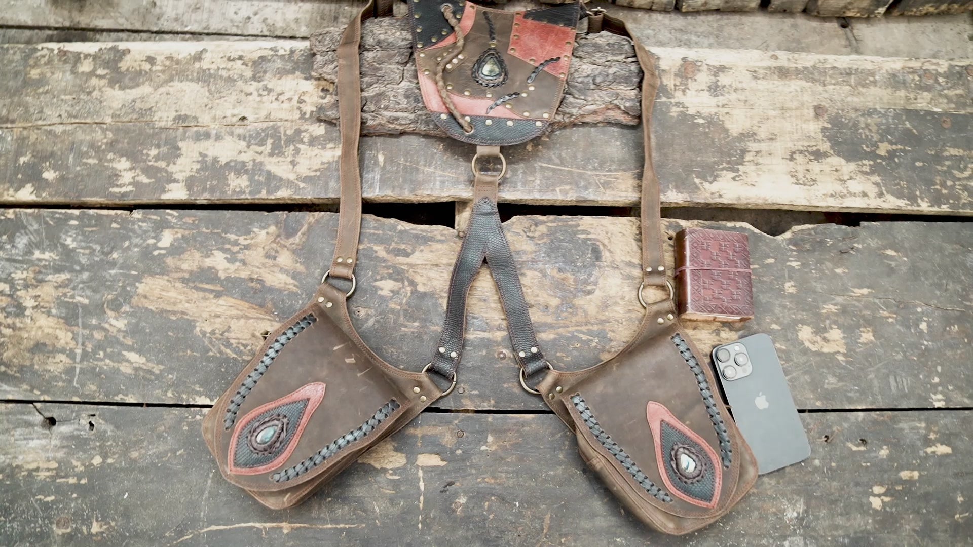 “Handcrafted brown leather holster with tribal patchwork design and stone inlay”