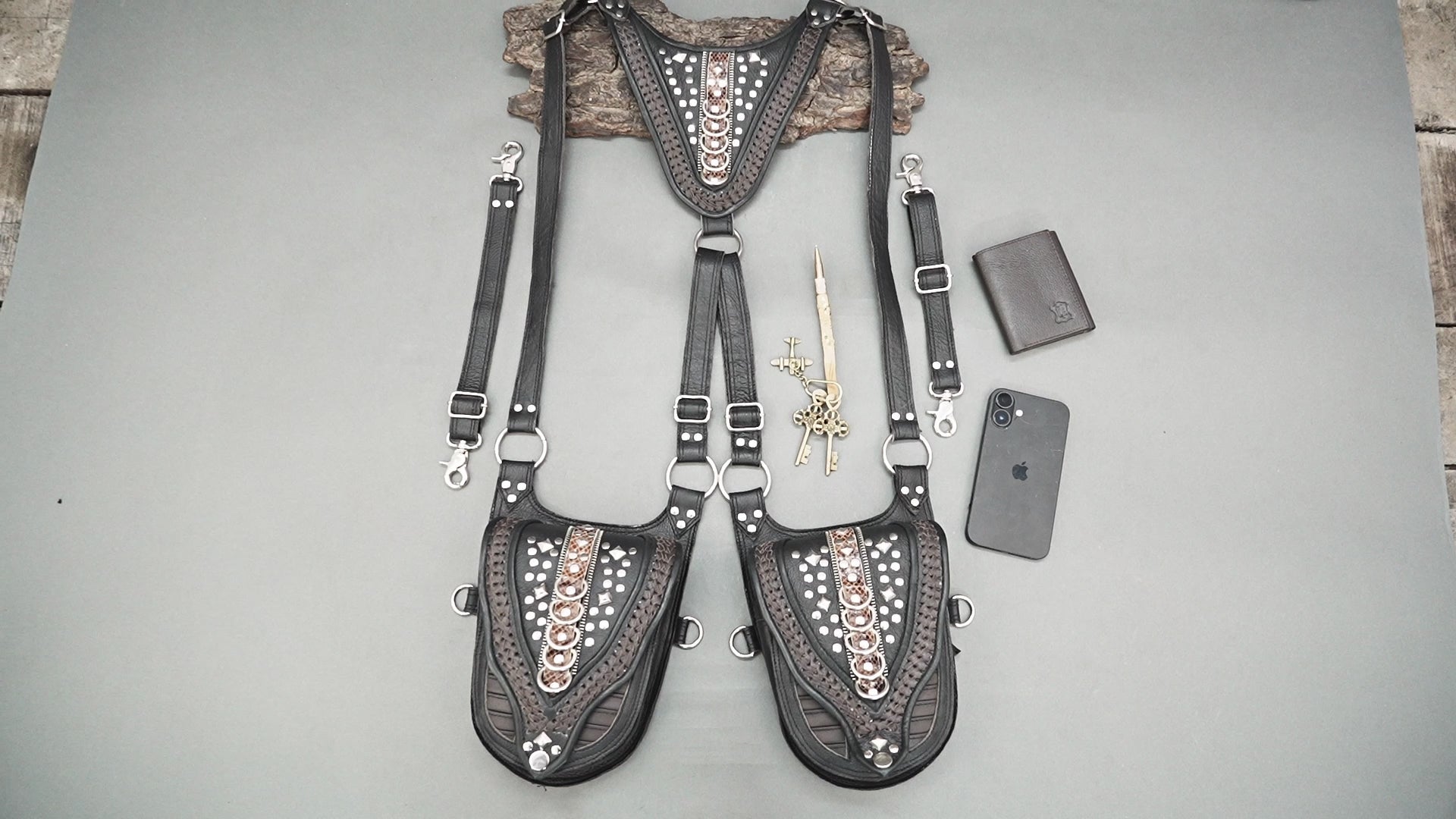 Handmade leather holster bag featuring embossed patterns and metal studs