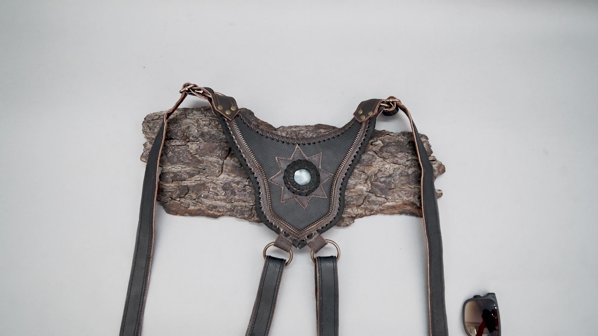 Premium black leather holster harness with stone centerpiece