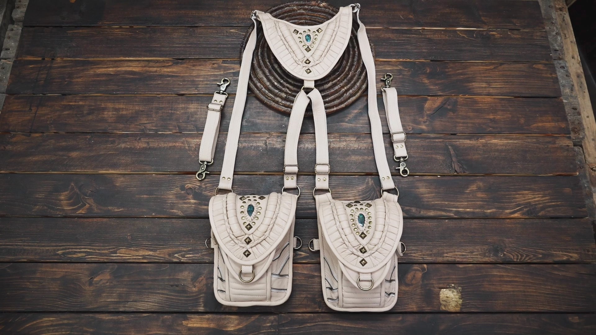 “Handcrafted cream leather festival holster with dual pouches and stone inlay”