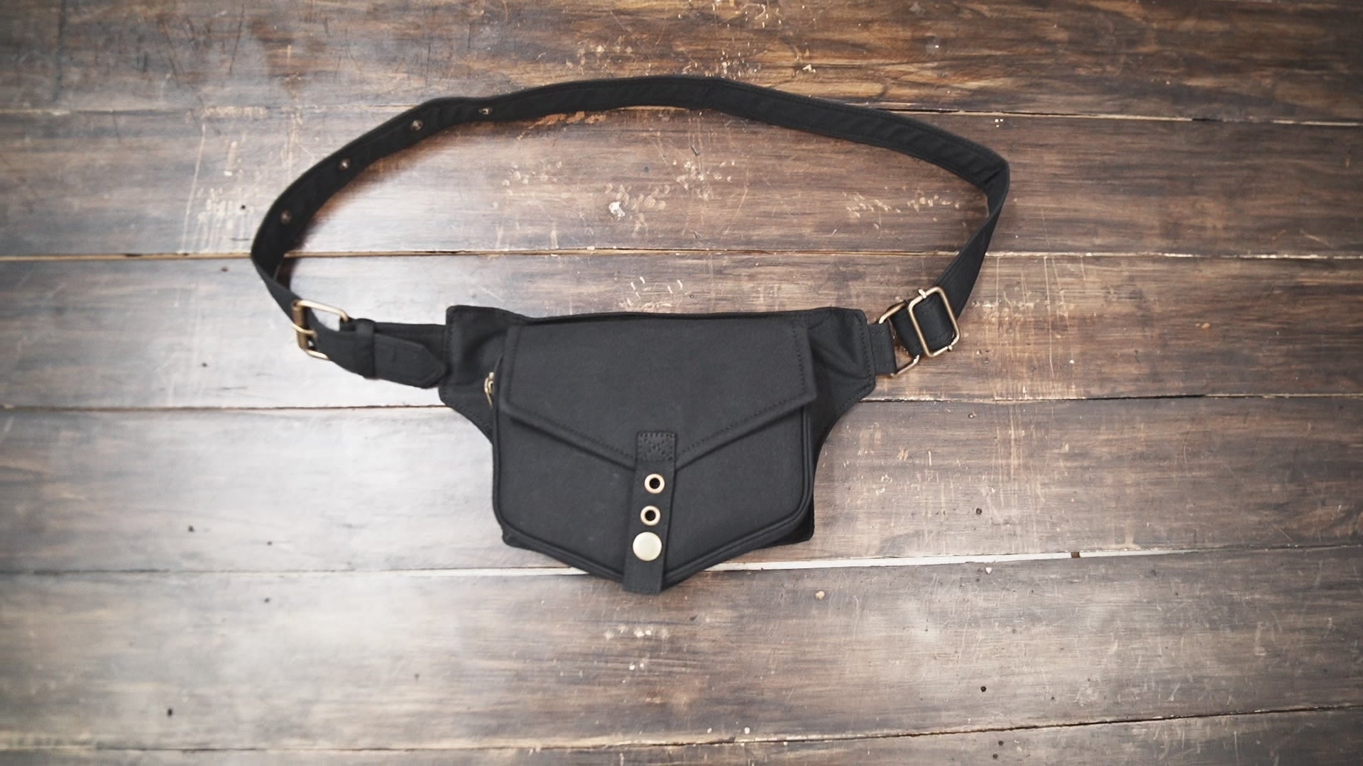 Minimalist black fanny pack with adjustable strap