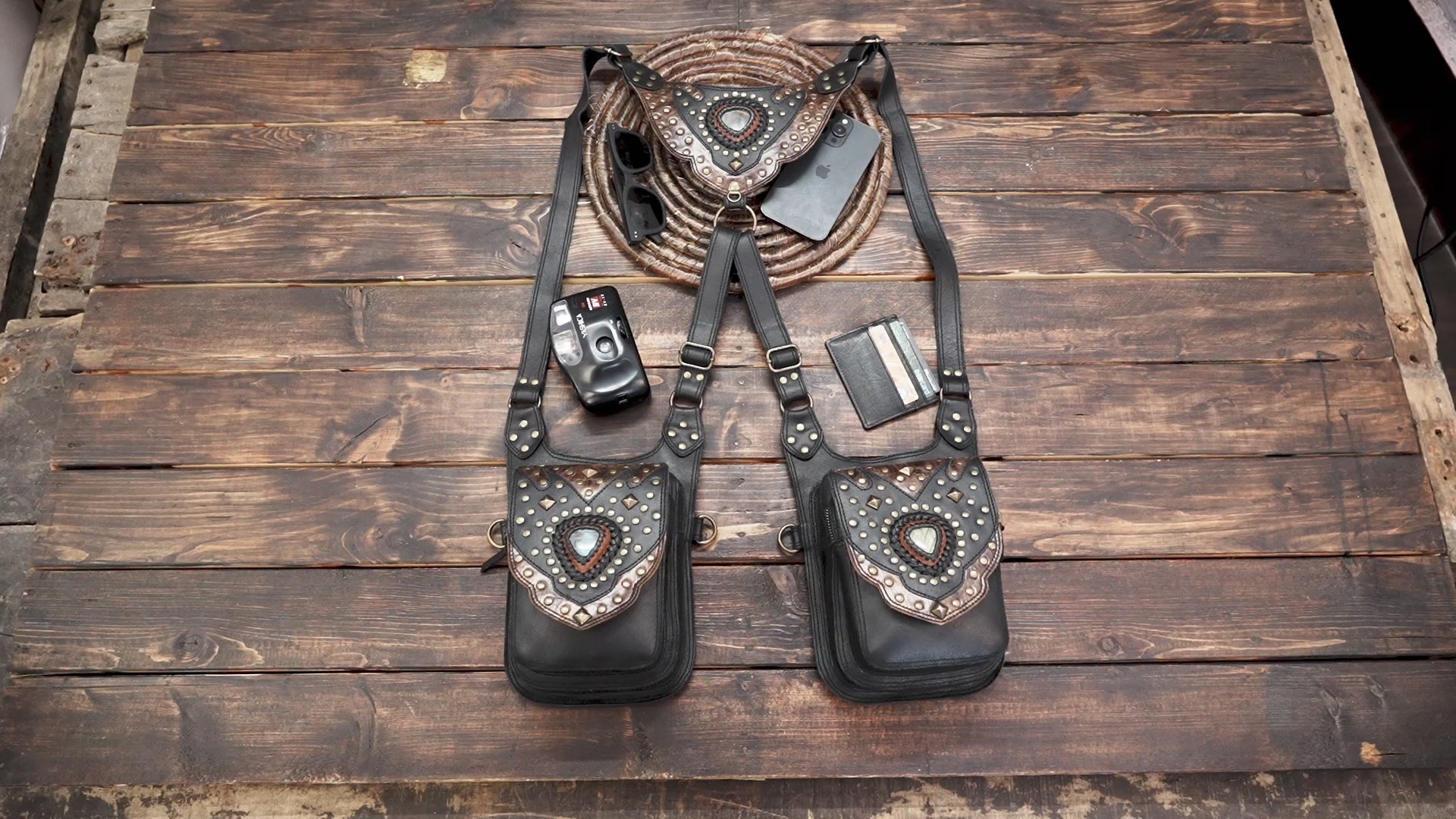 “Handcrafted leather utility holster featuring blue gemstone centerpiece and engraved detailing”
