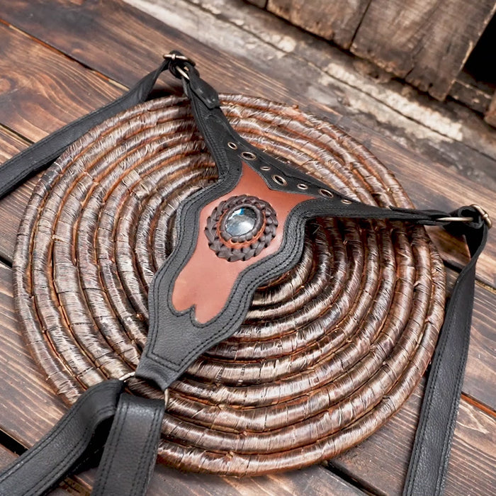 Handmade leather shoulder holster with gemstone accent centerpiece