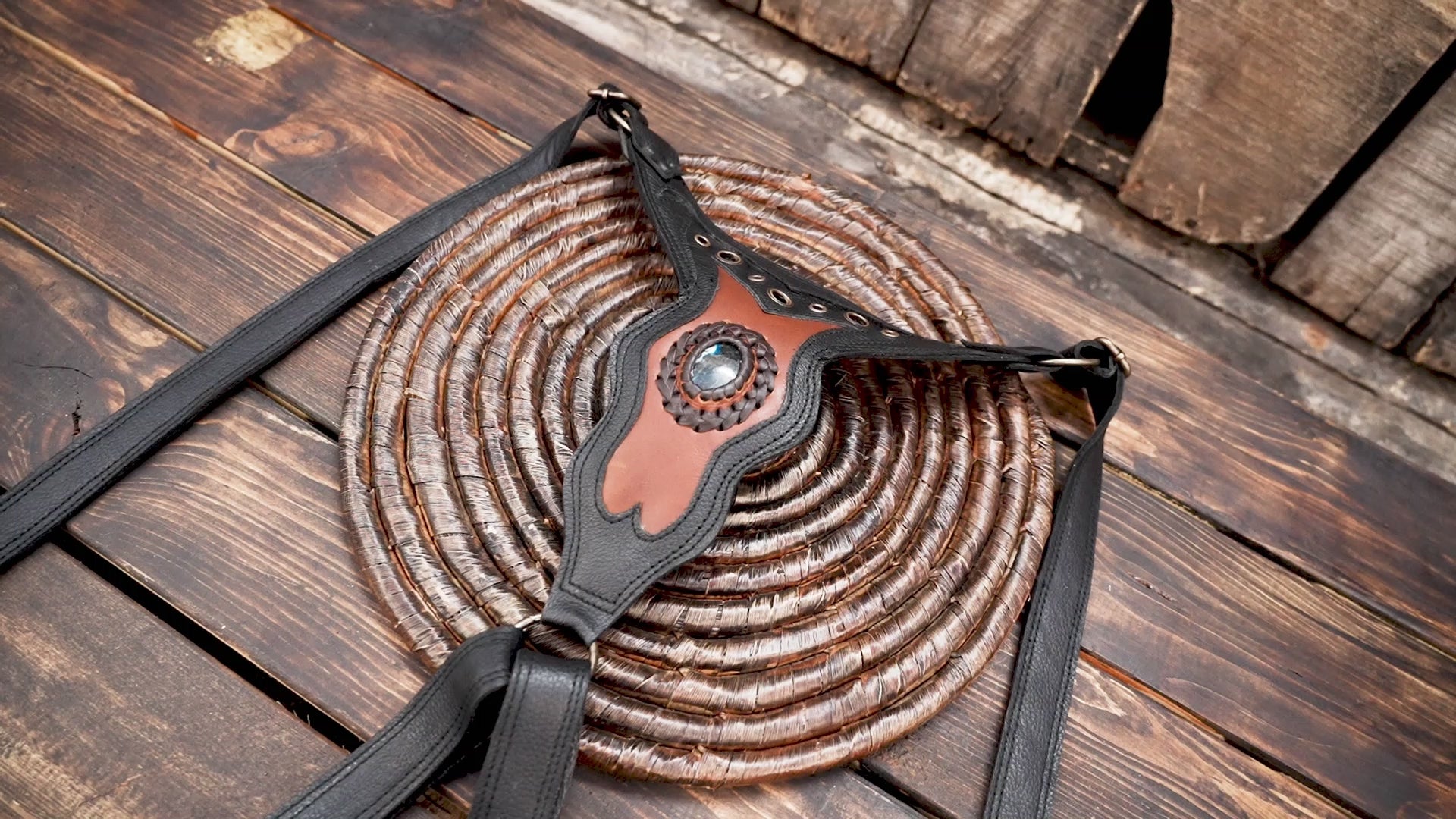 Handmade leather shoulder holster with gemstone accent centerpiece