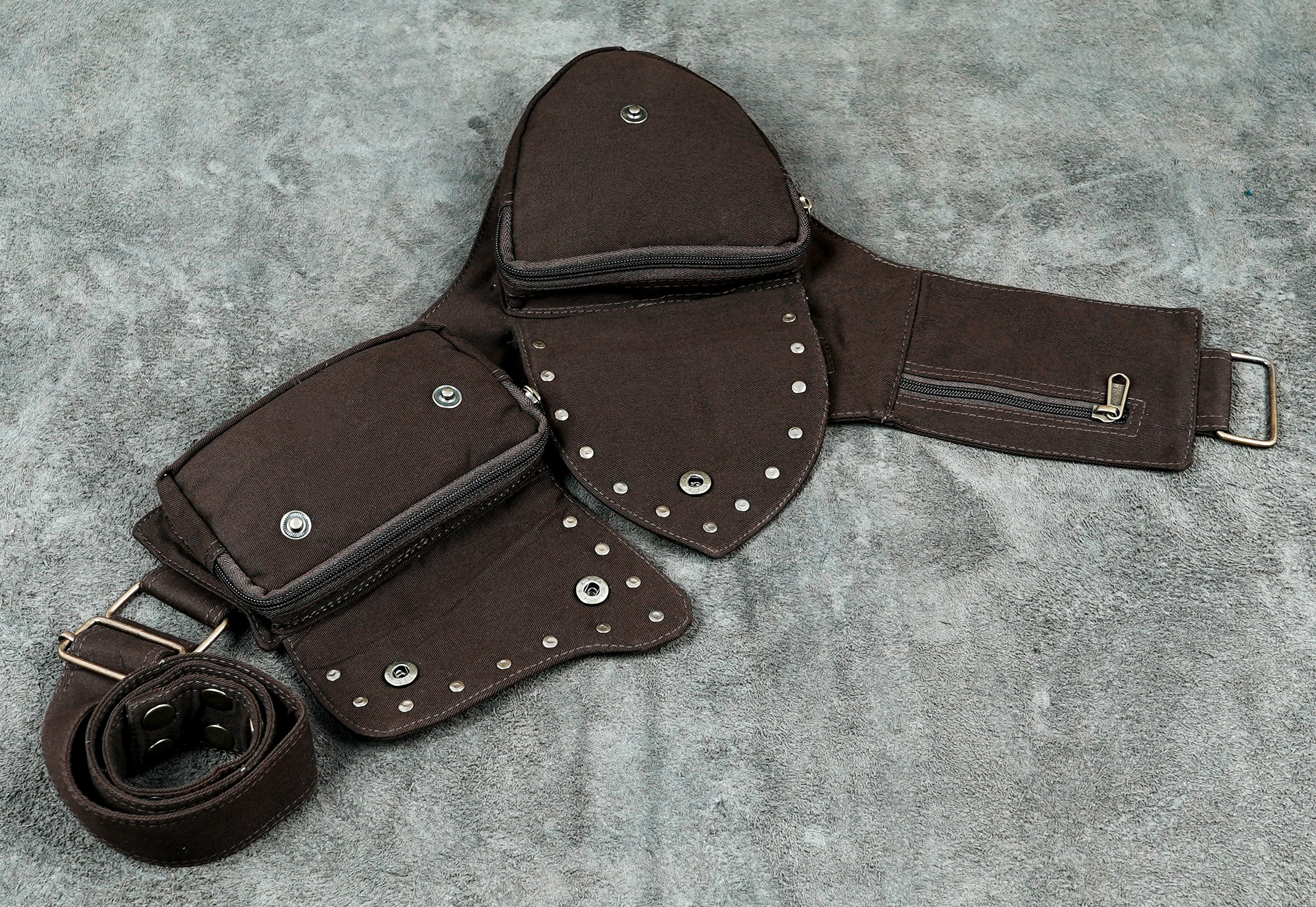 Brown cotton waist bag with lace-covered flaps and snap button closure